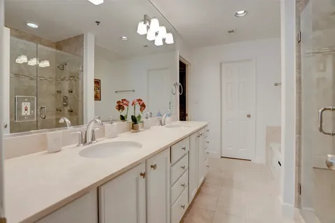 a bathroom with a bathtub and a shower