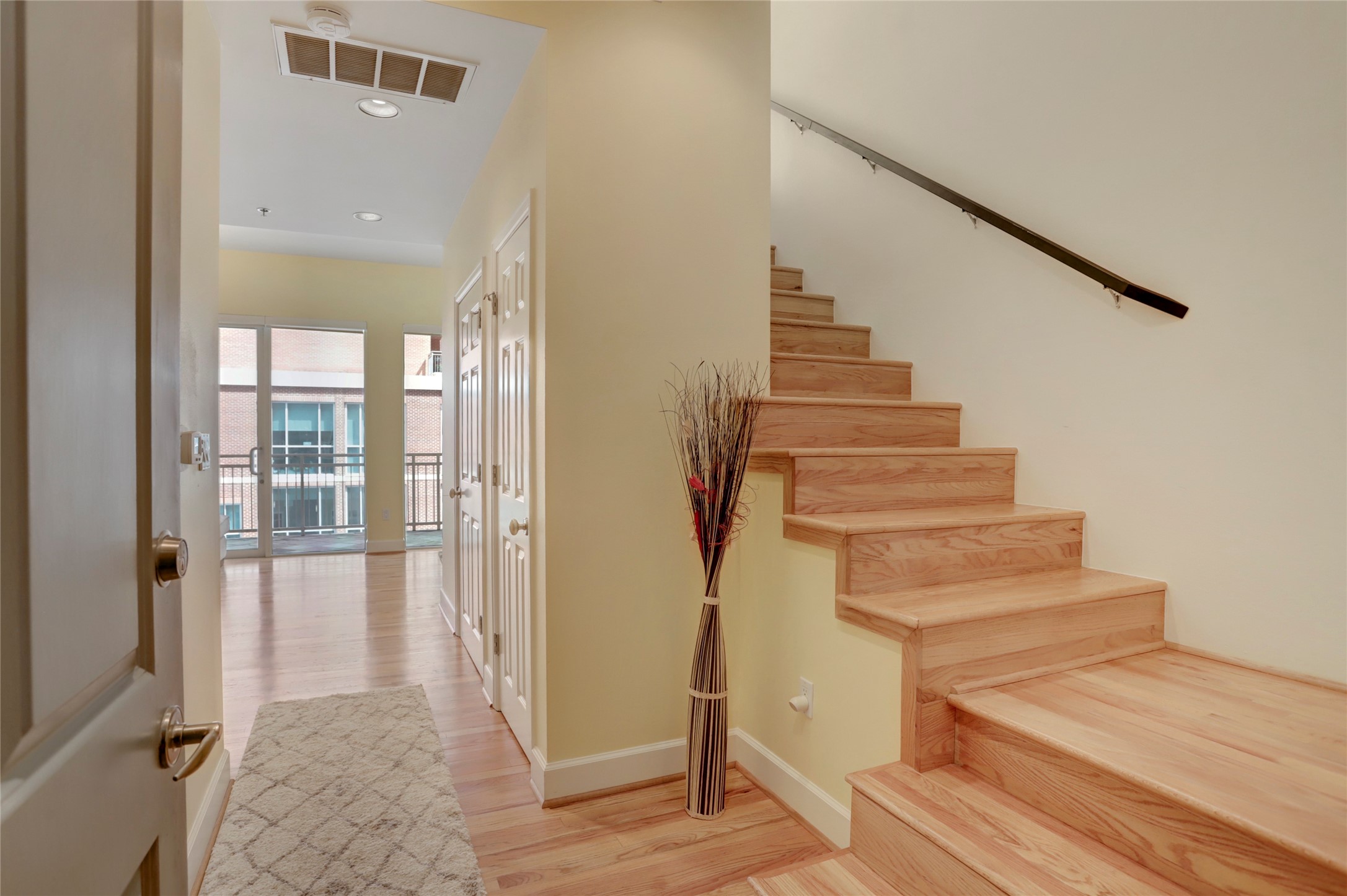 2520 Robinhood Street, Unit 1008 Houston, TX 77005 - Photo 2 of 27 a view of entryway and hall with wooden floor
