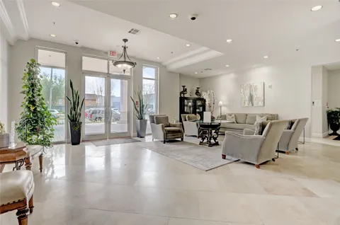 a view of a patio with couches chairs and a fire pit