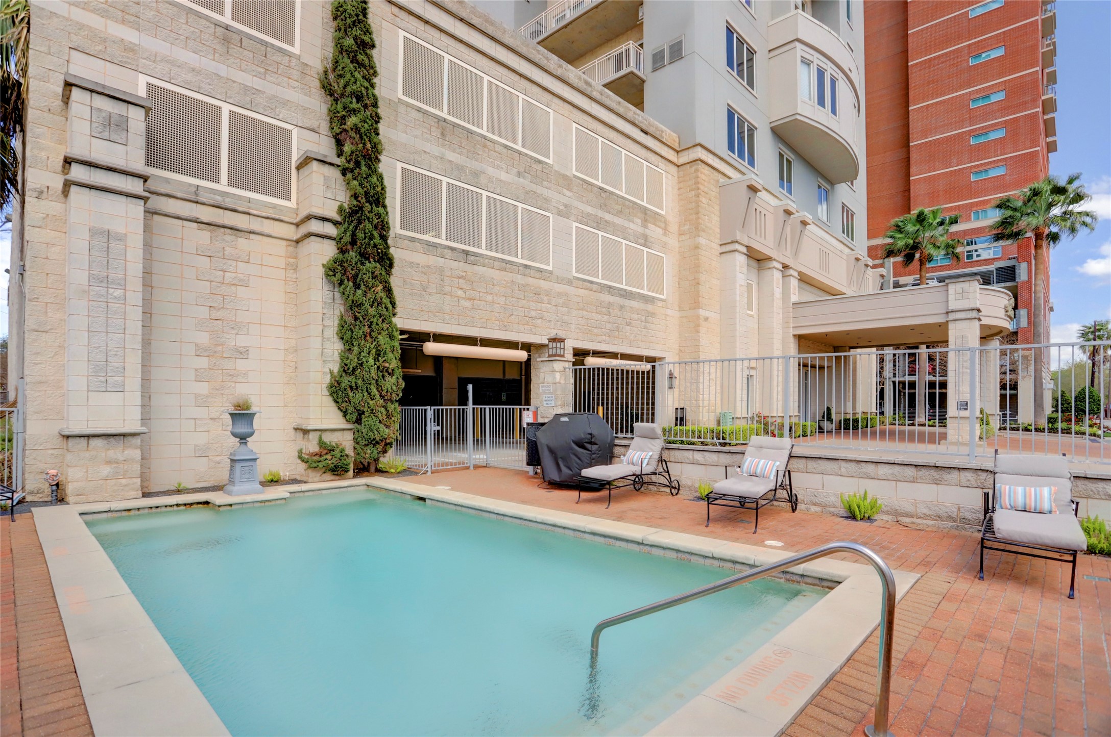 2520 Robinhood Street, Unit 1008 Houston, TX 77005 - Photo 22 of 27 a view of a patio with couches chairs and a fire pit