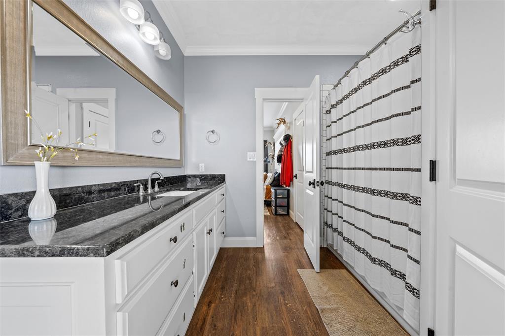 2045 Iron Bridge Road Lorena, TX 76655 - Photo 20 of 40 a kitchen with white cabinets and sink