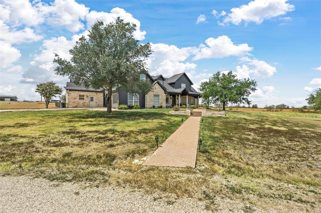 2045 Iron Bridge Road Lorena, TX 76655 - Photo 2 of 40 a view of a swimming pool with a yard