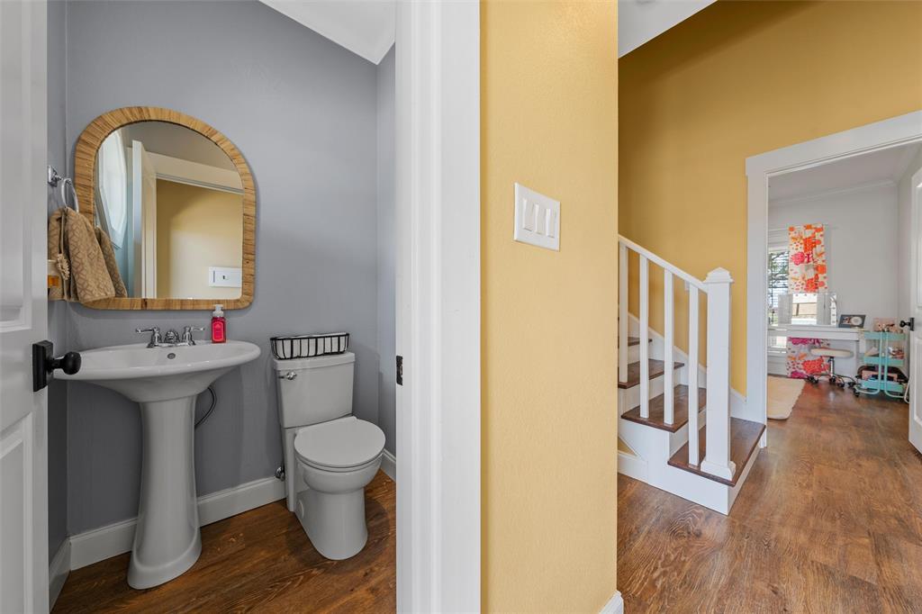 2045 Iron Bridge Road Lorena, TX 76655 - Photo 22 of 40 a bathroom with a toilet sink and mirror