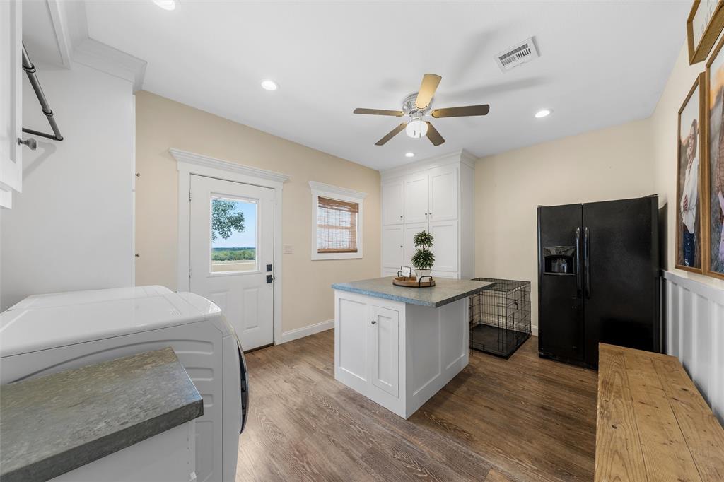 2045 Iron Bridge Road Lorena, TX 76655 - Photo 29 of 40 a kitchen with a refrigerator and a sink