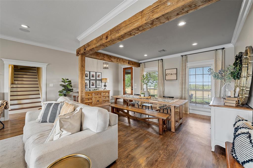 2045 Iron Bridge Road Lorena, TX 76655 - Photo 5 of 40 a living room with furniture floor to ceiling window and wooden floor