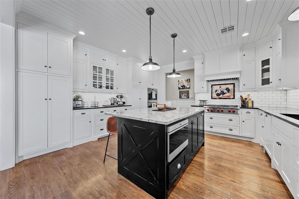 2045 Iron Bridge Road Lorena, TX 76655 - Photo 10 of 40 a kitchen with stainless steel appliances granite countertop a stove a sink and a refrigerator