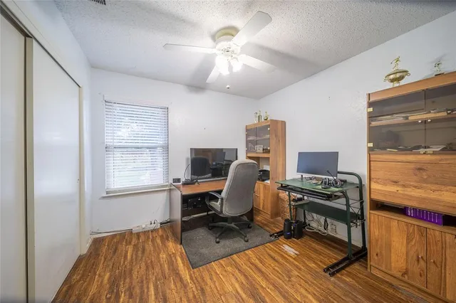 a workspace with furniture hardwood and a window