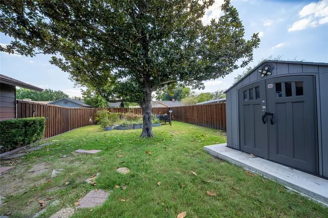 a backyard of a house with lots of green space