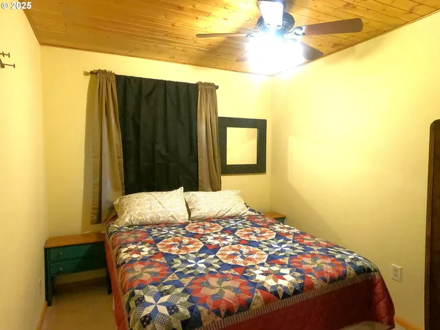 a bedroom with a bed and a cabinets