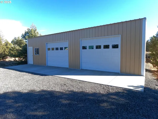 a view of a house with a wooden wall