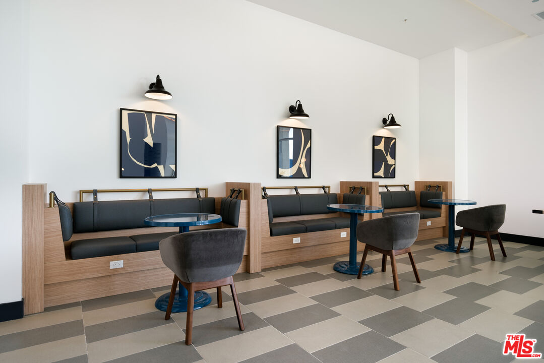 800 Western Avenue, Unit 510 Los Angeles, CA 90005 - Photo 15 of 26 a living room with furniture and a rug