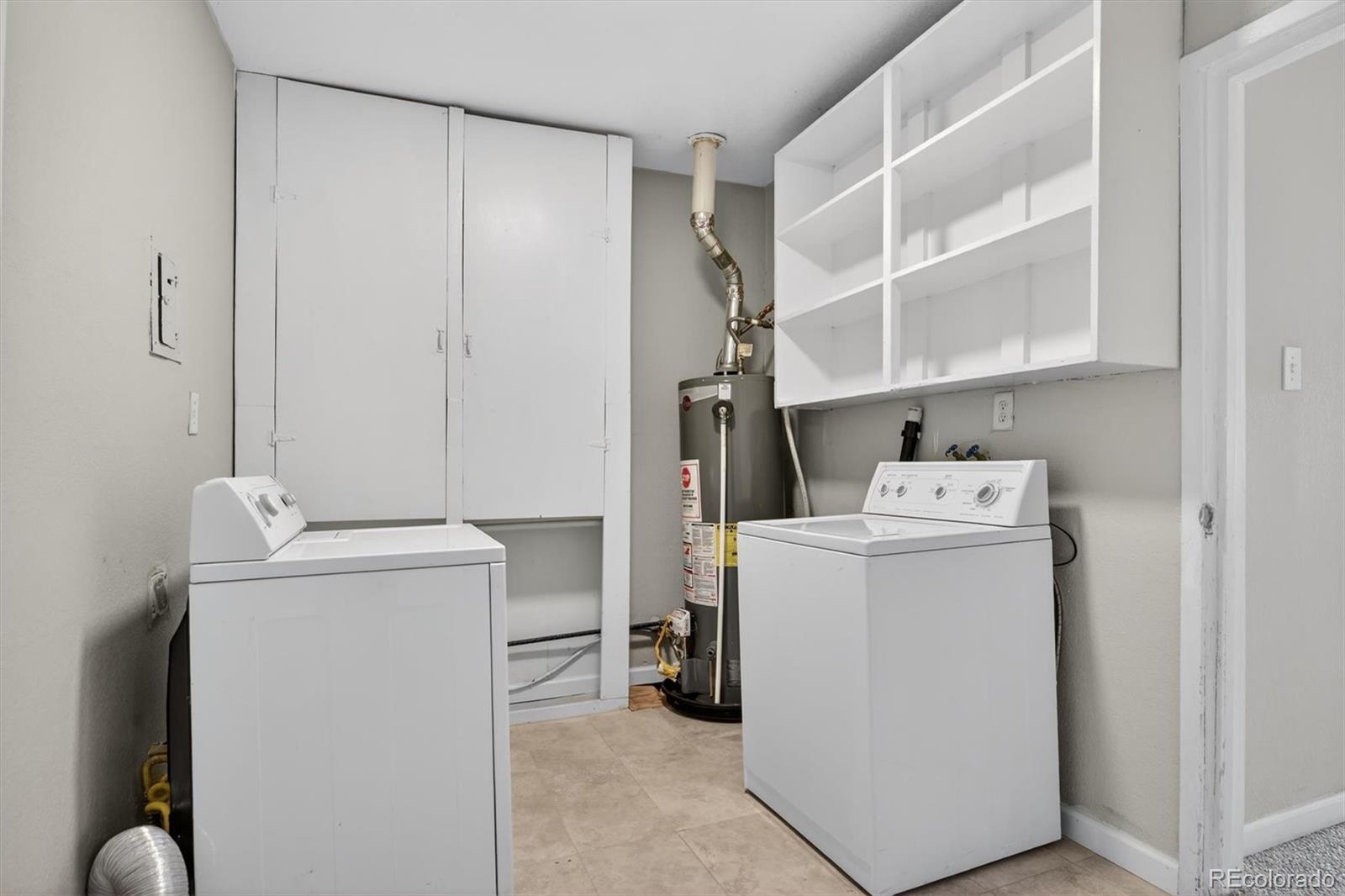 901 Racine Street Aurora, CO 80011 - Photo 22 of 29 a utility room with dryer and washer
