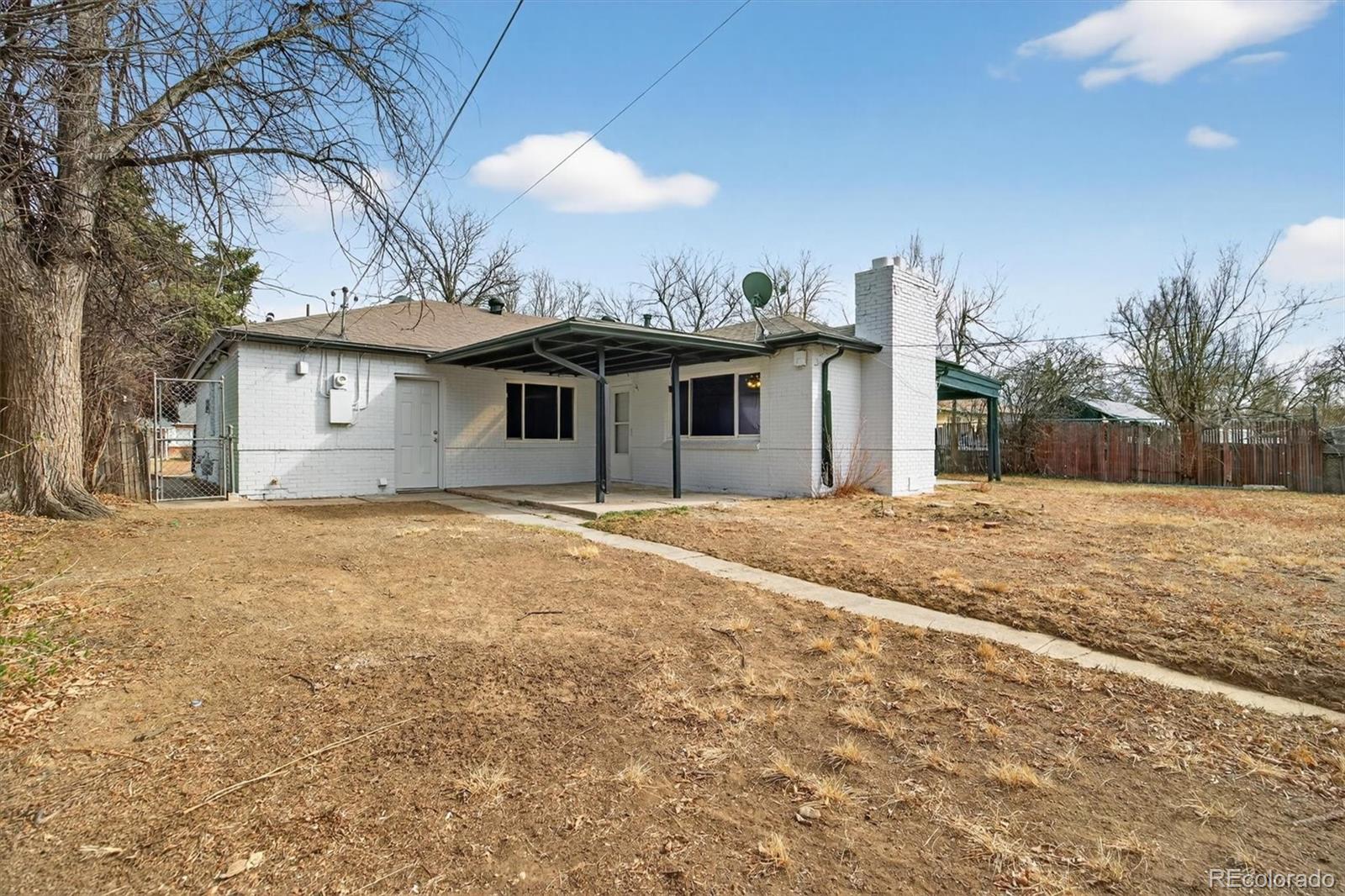 901 Racine Street Aurora, CO 80011 - Photo 26 of 29 a front view of house with yard