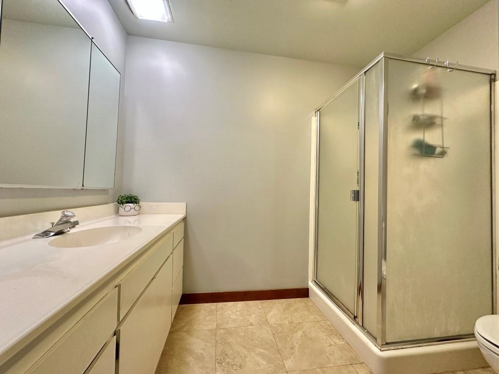 10 Graeagle Meadows Road Graeagle, CA 96103 - Photo 13 of 25 a bathroom with a shower sink and toilet