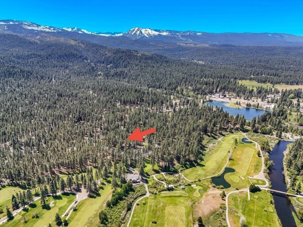 10 Graeagle Meadows Road Graeagle, CA 96103 - Photo 21 of 25 a view of a lake with a mountain in the background