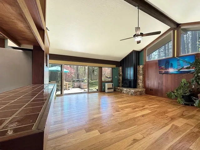 a view of an entryway with wooden floor