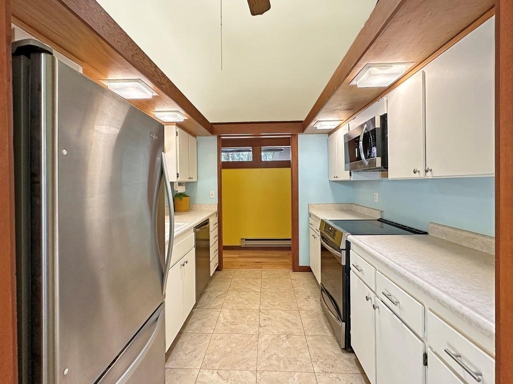 10 Graeagle Meadows Road Graeagle, CA 96103 - Photo 7 of 25 a kitchen with a refrigerator and a sink