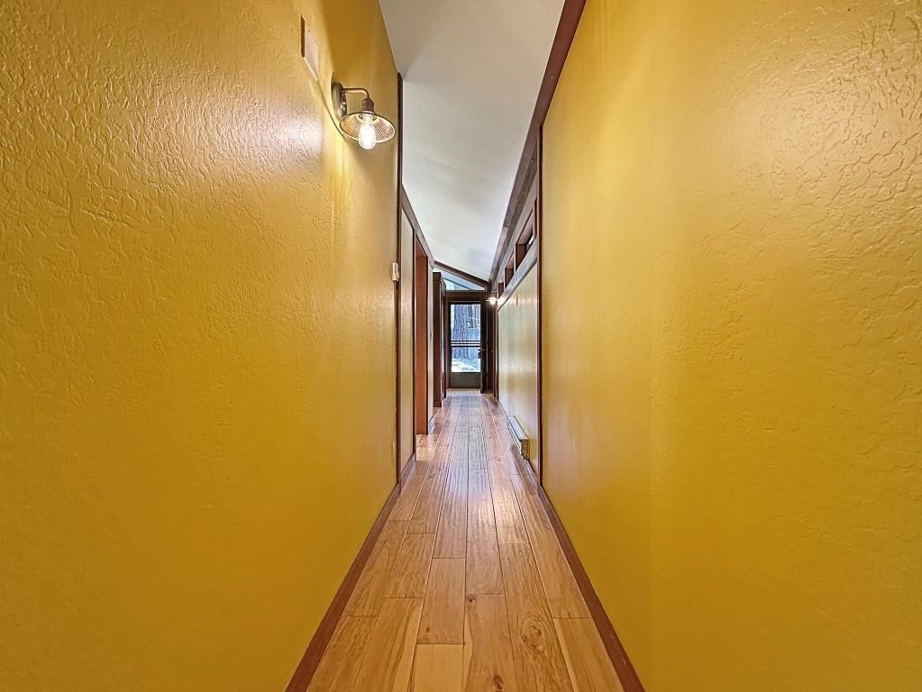 10 Graeagle Meadows Road Graeagle, CA 96103 - Photo 9 of 25 a view of a hallway with wooden floor