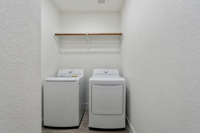 a utility room with dryer and washer
