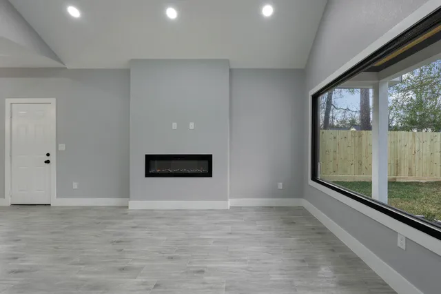 a view of an empty room with a window