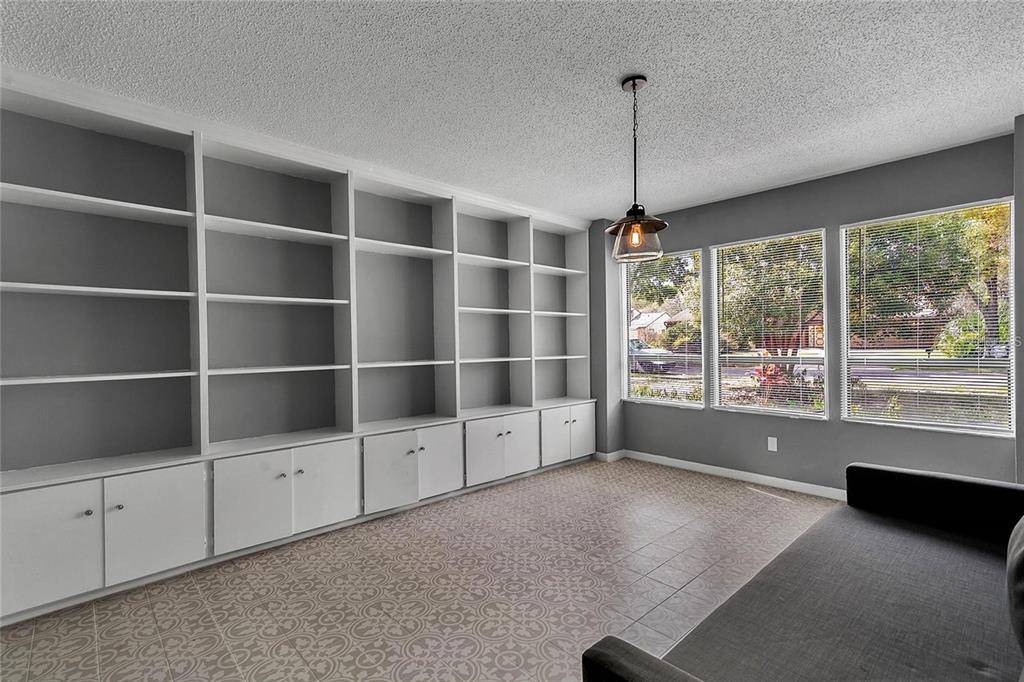5607 Spring Run Avenue Orlando, FL 32819 - Photo 12 of 20 a view of workspace with furniture and large window