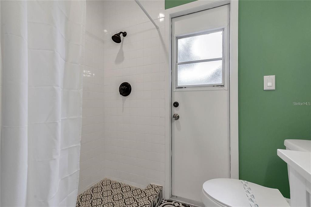 5607 Spring Run Avenue Orlando, FL 32819 - Photo 18 of 20 a bathroom with a toilet and a shower