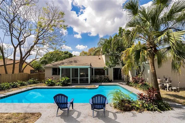a front view of house with yard and outdoor seating