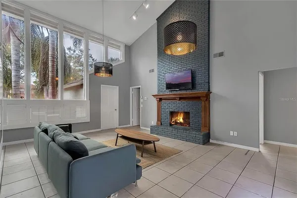 a living room with furniture and a fireplace