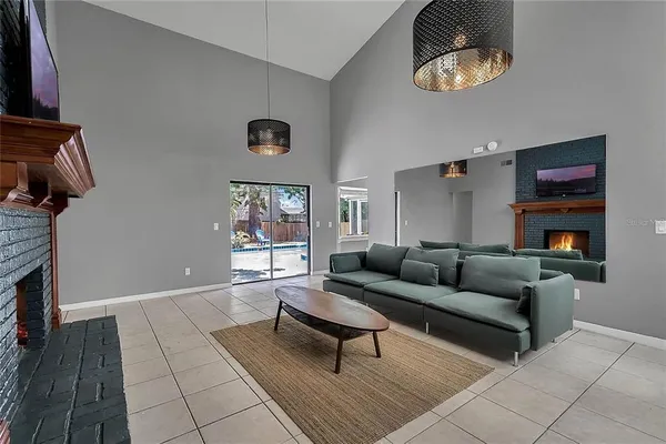 a living room with furniture and a fireplace