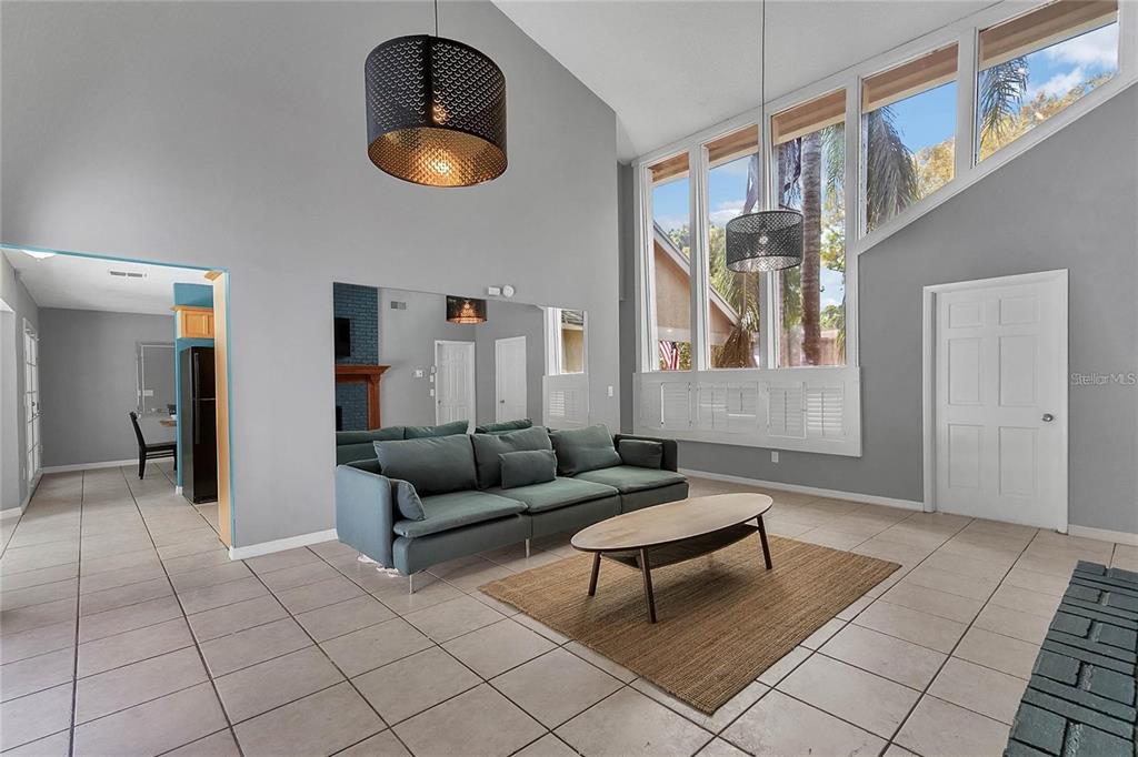 5607 Spring Run Avenue Orlando, FL 32819 - Photo 7 of 20 a living room with furniture and a window