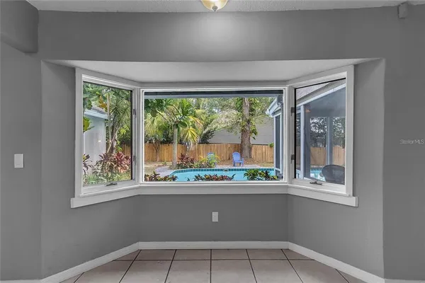 a kitchen with a window and outdoor space