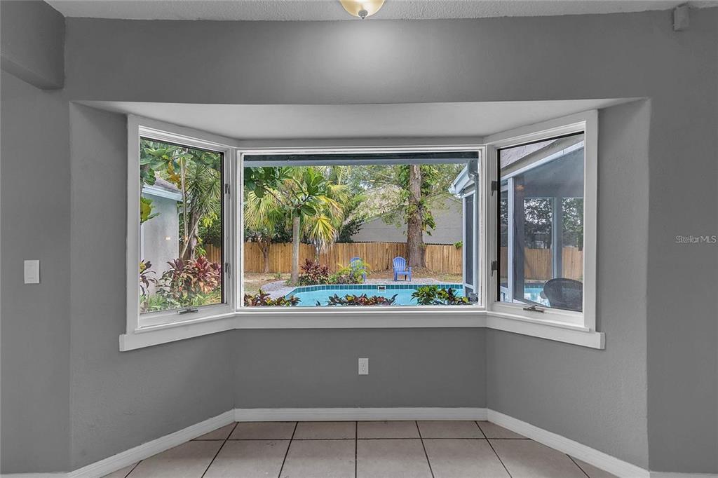 5607 Spring Run Avenue Orlando, FL 32819 - Photo 8 of 20 a kitchen with a window and outdoor space