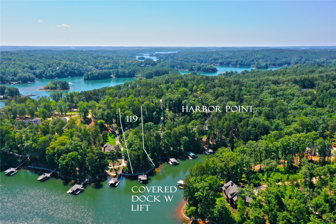 1359 Hbr Rdg Road Seneca, SC 29672 - Photo 1 of 39 Discover expansive waterfront views with private dock access, nestled in a lush, wooded landscape.