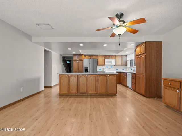 a view of kitchen with wooden floor