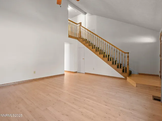 a view of an entryway with wooden floor