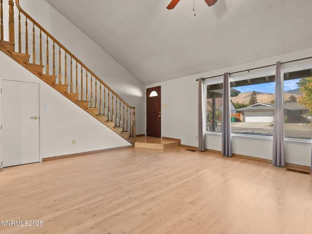 a view of an empty room with stairs
