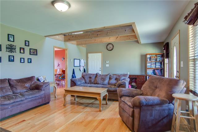 8813 West Sheepneck Road Mount Pleasant, TN 38474 - Photo 7 of 19 WOOD BEAMS IN THE CEILING OF THE LIVING ROOM SHOWS THE UPSTAIRS REC ROOM