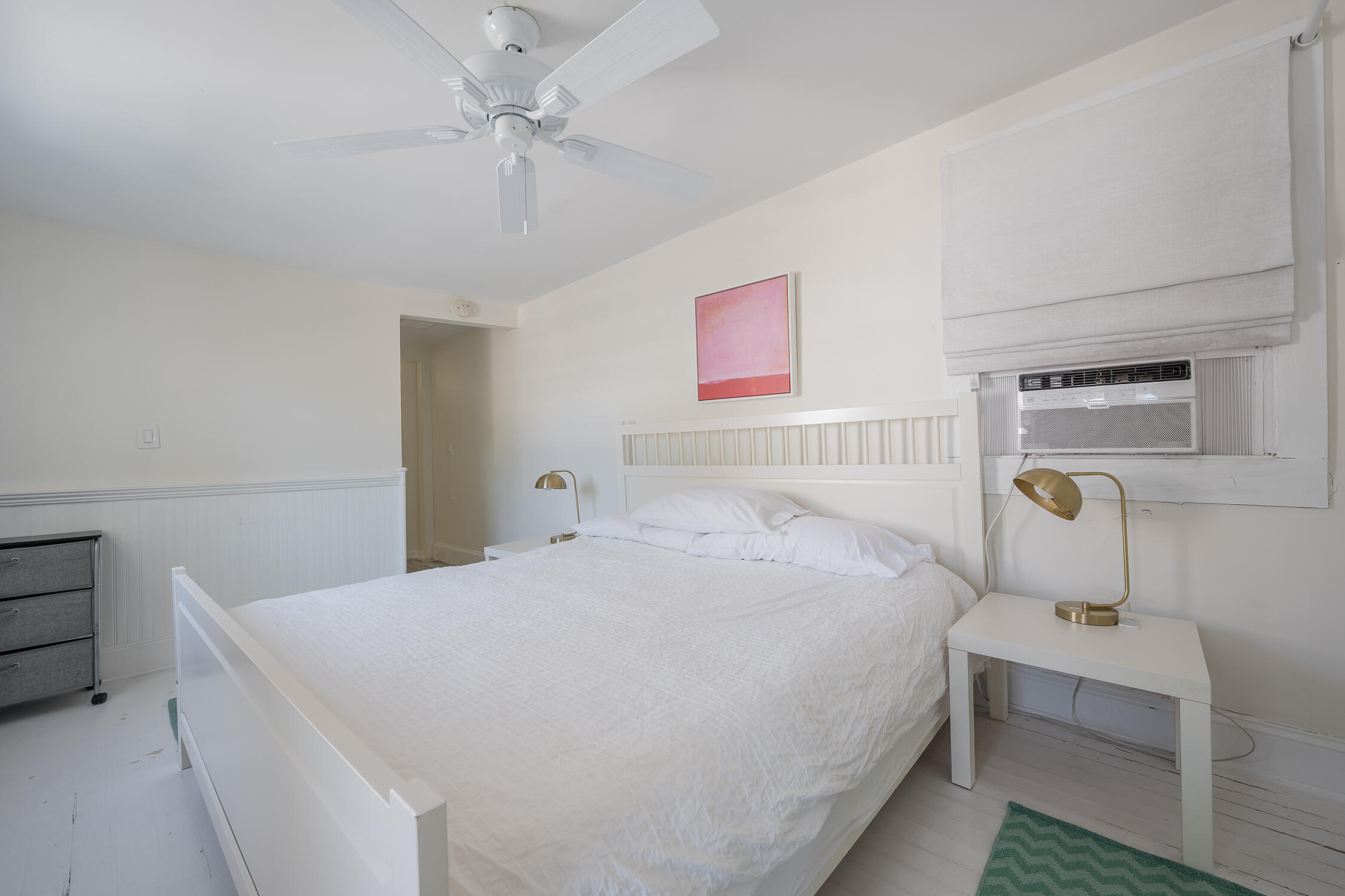 609 1/2 Margaret Street Key West, FL 33040 - Photo 12 of 35 a bedroom with a bed and a chandelier