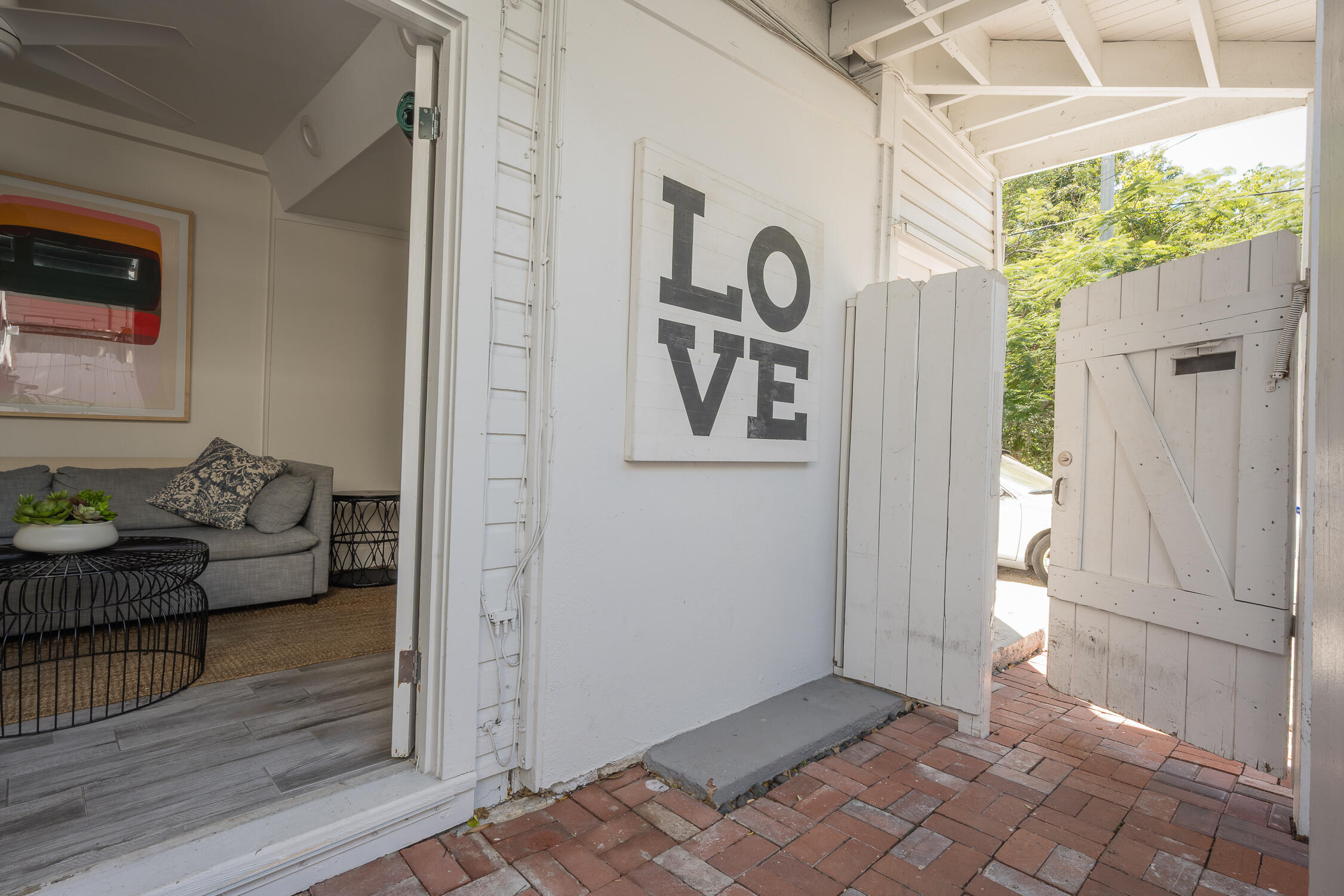 609 1/2 Margaret Street Key West, FL 33040 - Photo 32 of 35 a view of a porch with furniture and front door