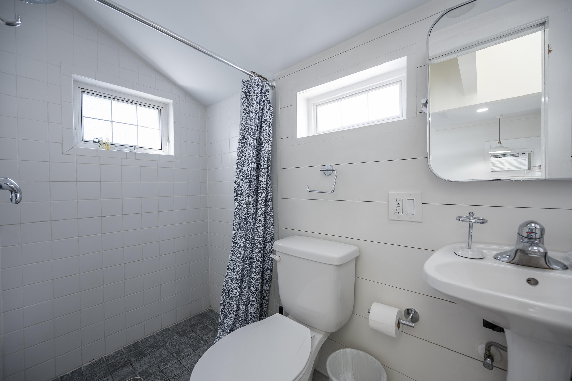 609 1/2 Margaret Street Key West, FL 33040 - Photo 8 of 35 a white toilet sitting next to a bathroom sink