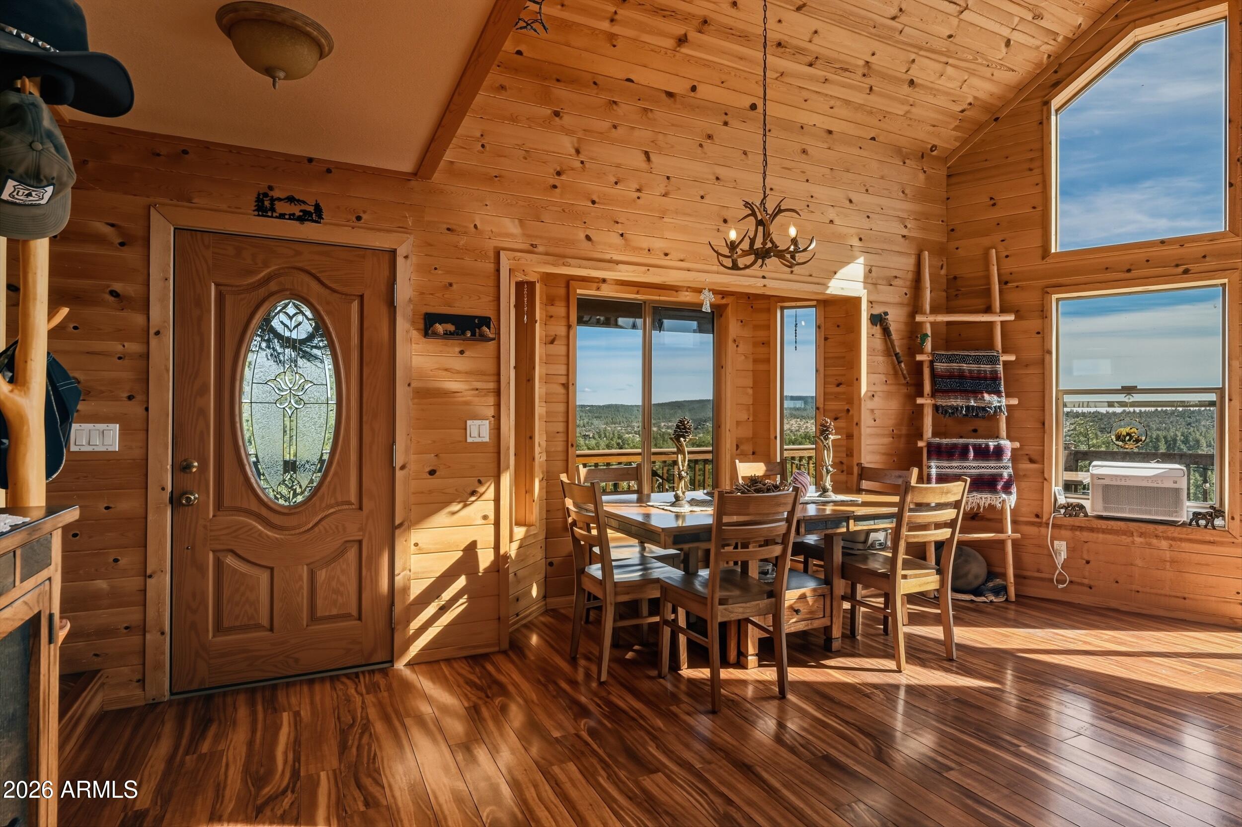 3119 Kysar Way Pine, AZ 85544 - Photo 9 of 68 a view of a dining room with furniture window and wooden floor