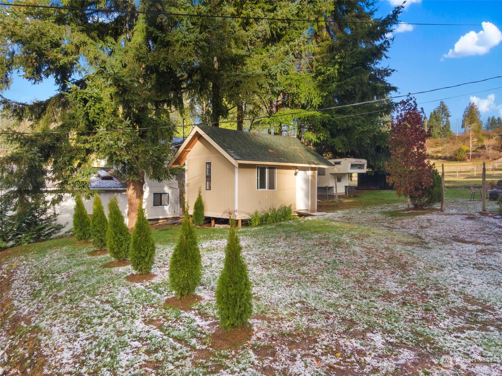 14322 Three Lakes Road Snohomish, WA 98290 - Photo 3 of 36 a view of a house with backyard and trees