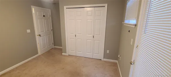 a view of a balcony with wooden floor