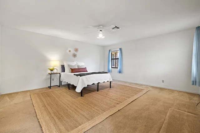 a utility room with cabinets washer and dryer