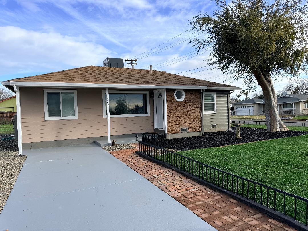 245 Delano Street Elverta, CA 95626 - Photo 1 of 1 a front view of a house with a garden