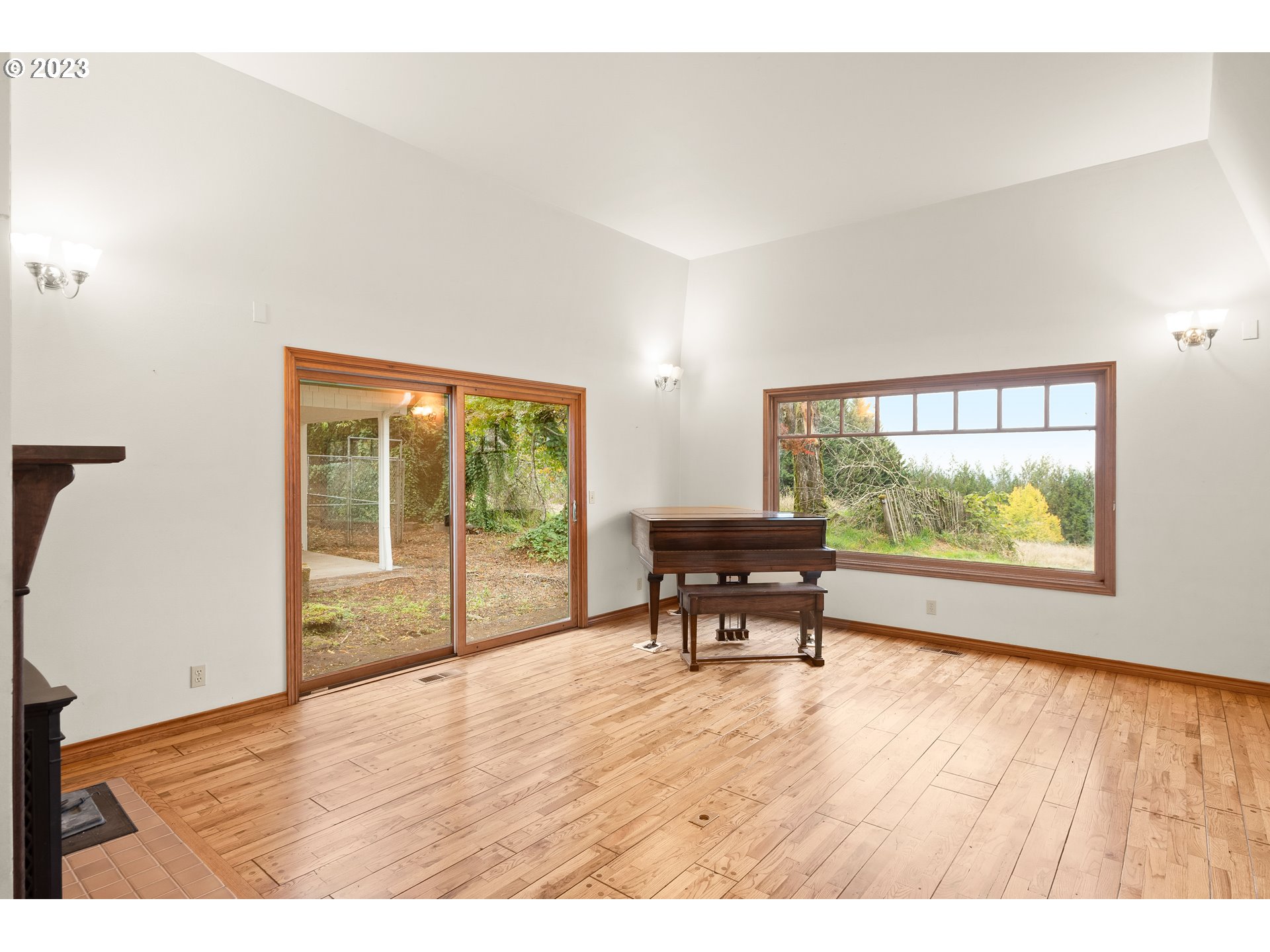15190 Southwest Bell Road Sherwood, OR 97140 - Photo 14 of 44 a view of an empty room with wooden floor and a window