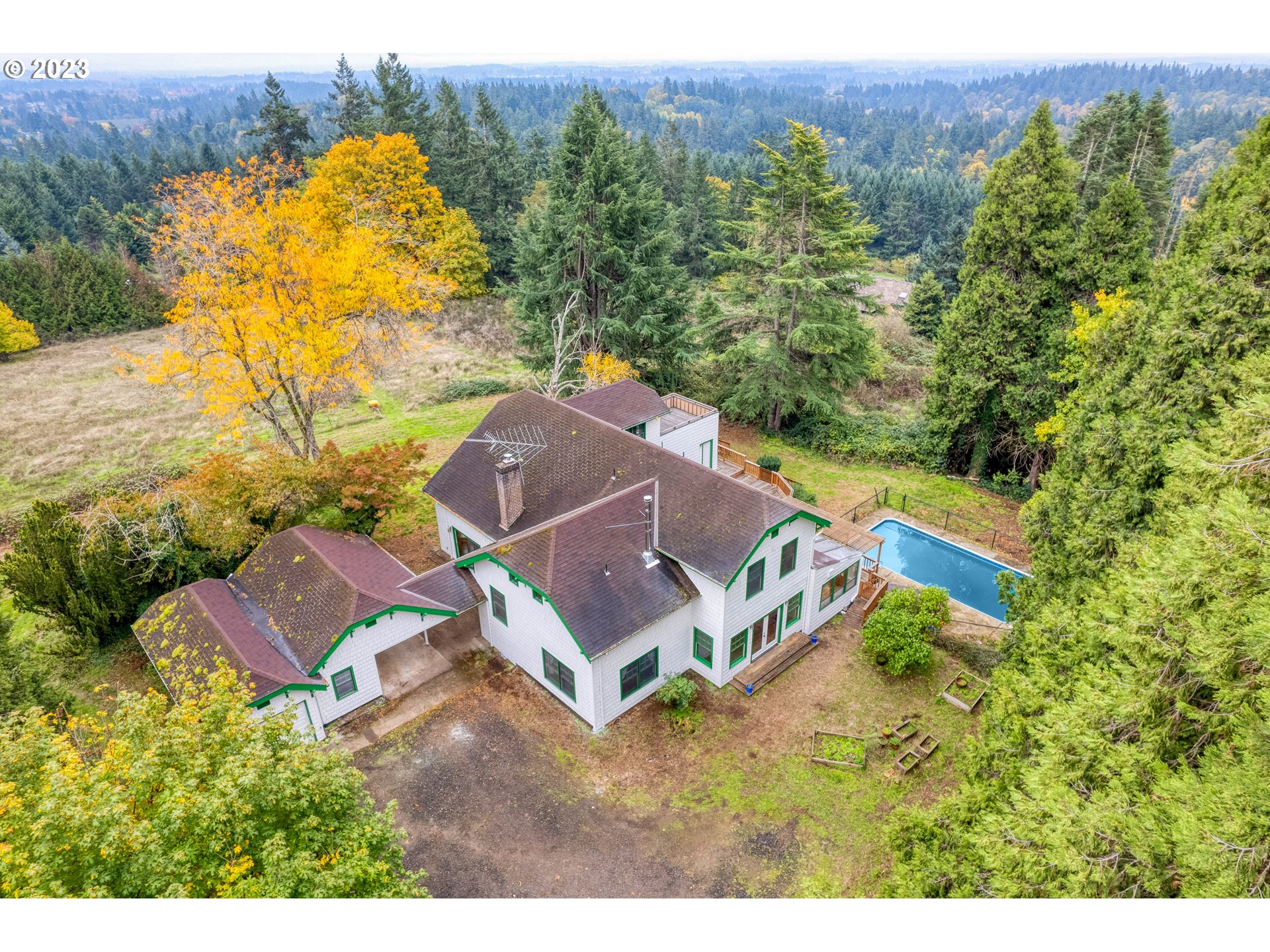 15190 Southwest Bell Road Sherwood, OR 97140 - Photo 3 of 44 an aerial view of a house with a yard and trees