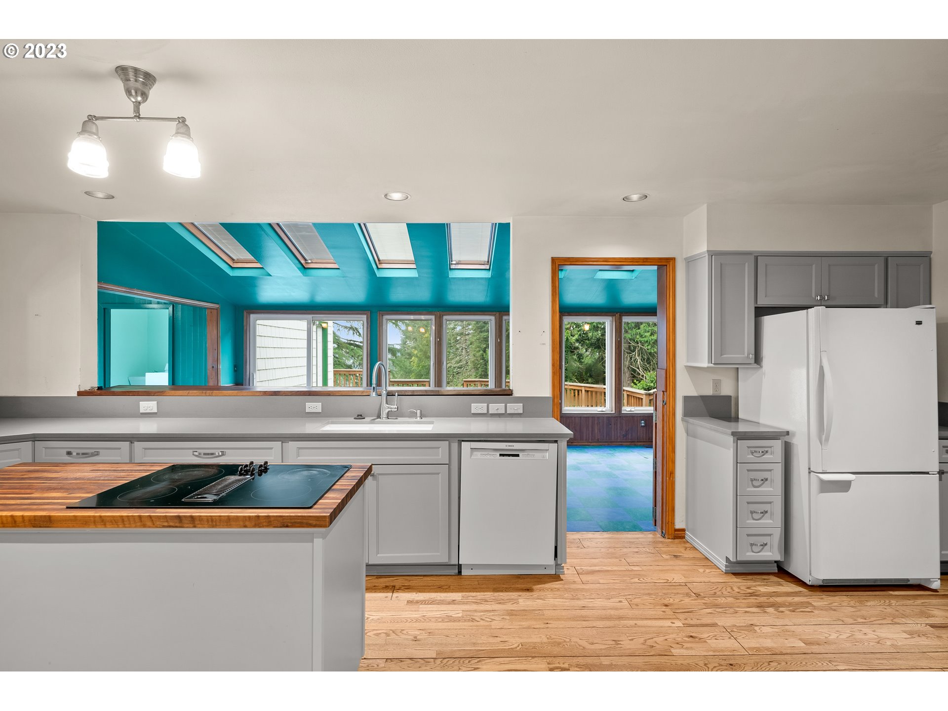 15190 Southwest Bell Road Sherwood, OR 97140 - Photo 10 of 44 a kitchen with stainless steel appliances granite countertop a sink and a refrigerator