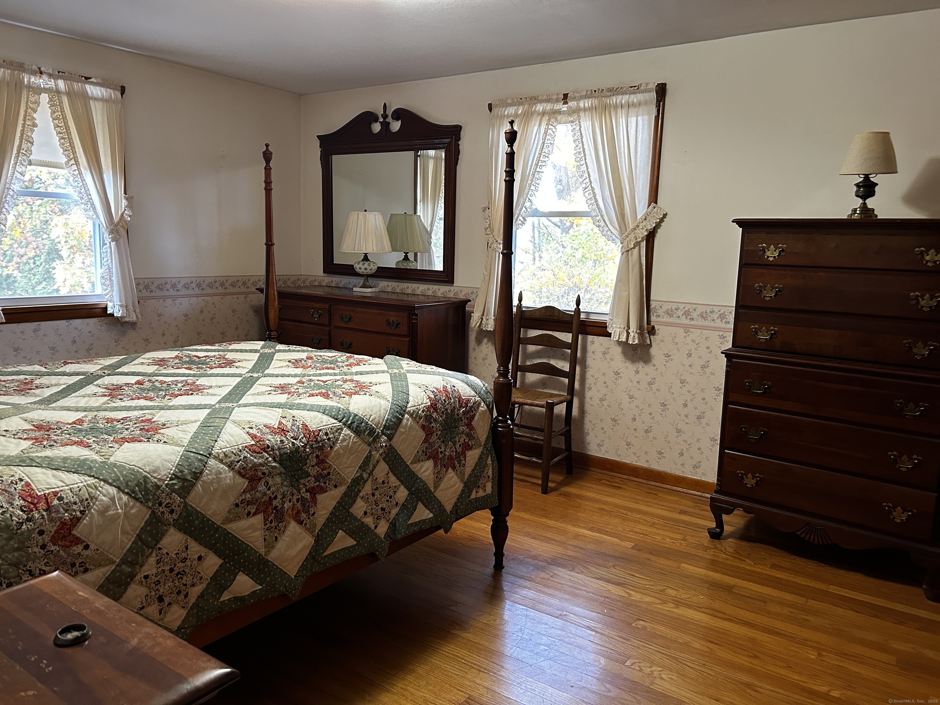 69 Wauregan Road Killingly, CT 06239 - Photo 13 of 23 a bedroom with a bed and a dresser