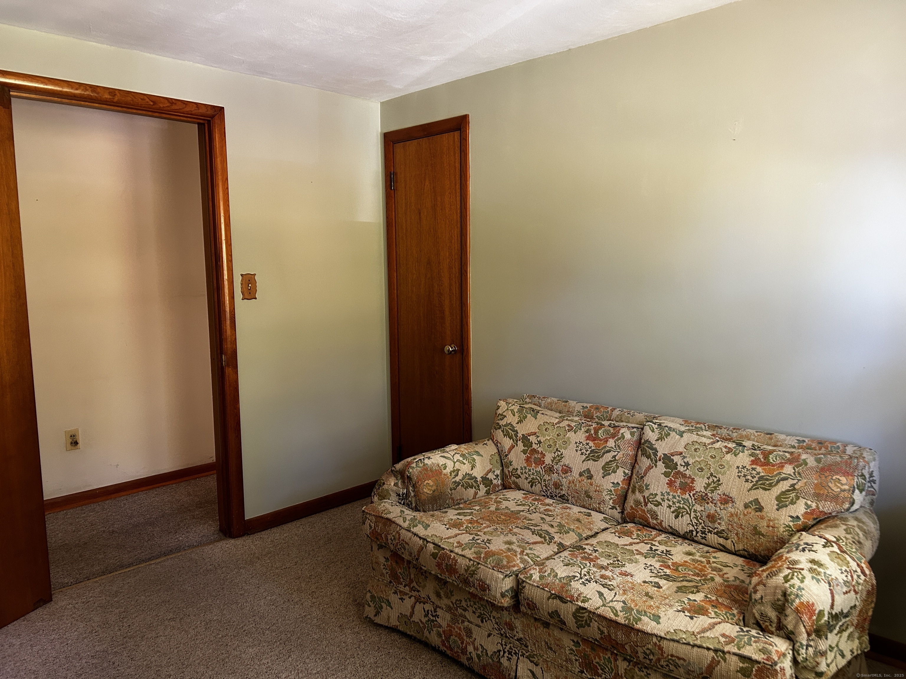 69 Wauregan Road Killingly, CT 06239 - Photo 18 of 23 a bedroom with a bed and a painting on the wall